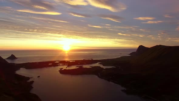 Aerial footage of midnight sun in Norway alt