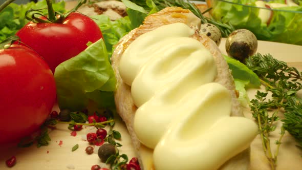Close Up Delicious Grilled Chicken Covered with Mayonnaise with Fresh Greens and Spice alt