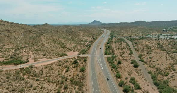 Panoramic view a trip at high speed through the Arizona desert to the distant mountains alt