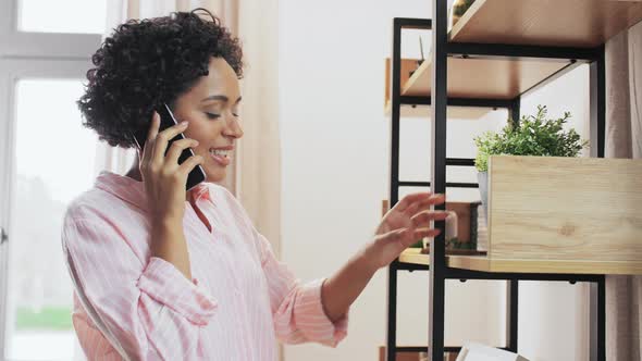 Happy Smiling Woman Calling on Smartphone at Home alt