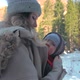 Mother Carry Her Infant Son in a Bay Carrier During Mountain Hiking - VideoHive Item for Sale