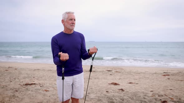 Mature Man Exercising At The  Beach alt
