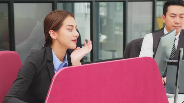 Asian young business man and woman people group having a discussion meeting, working in office. alt
