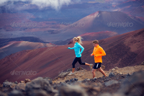 Fitness sport couple running jogging outside on trail - Stock Photo - Images