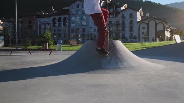 Extreme Park for Training of Skateboarding Young Sporty Man is Skating alt