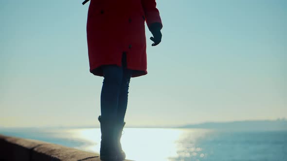 Stylish Woman Legs In Winter Boots Walking On Vacation Holiday In Cold Winter Day. alt