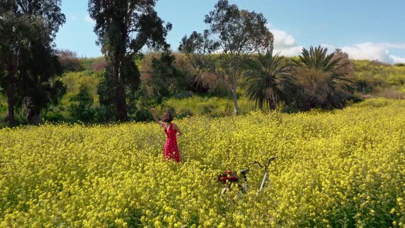 A Young Woman Came on a Bicycle To Nature and Enjoys the Beauty Around alt