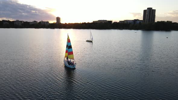 boats at Lake Bde Maka Ska during sunset in a summer evening, travel minnesota alt