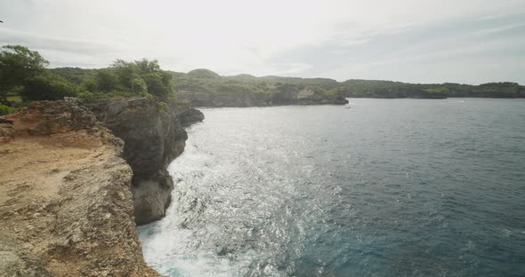 Truck View of the Stunning Steep Cliffs Near Clear Blue Ocean on the Broken Beach Pasih Uug in Bali alt