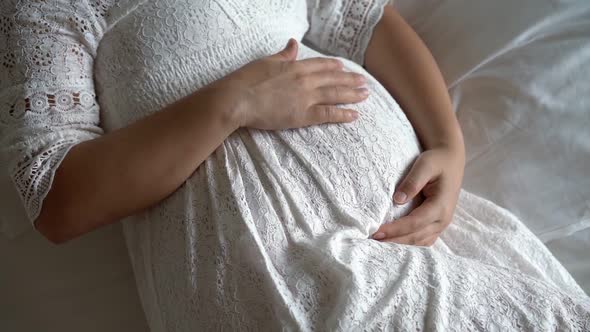 Happy Pregnant Woman and Expecting Baby at Home alt