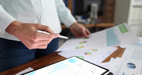 Businesswoman Examines Business Charts at Workplace Slow Motion  Movie alt