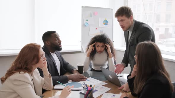 Diverse Employees Arguing During Team Meeting African Office Worker Disagreeing with Caucasian alt