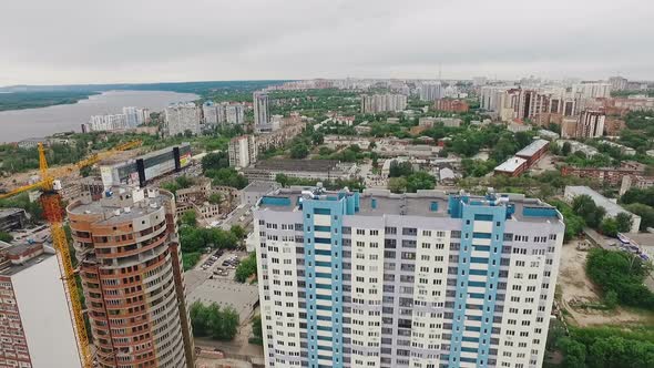 Aerial View of Samara City, Drone Flies Over Small Football Area and Modern Buildings