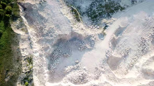 Bulldozer excavator truck, heavy duty digging stone, quarry, stone work, air view alt