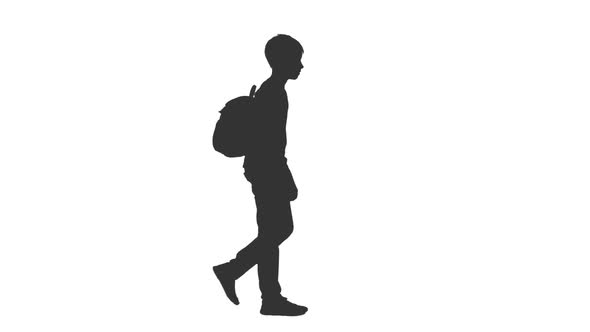 Silhouette of Schoolboy Walking With Backpack