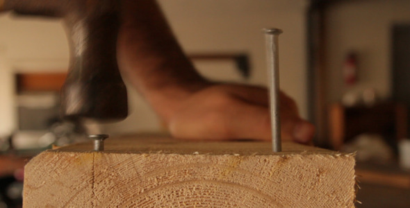 Hammering Nails Into Wood