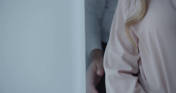 The Man Gently Touches The Girl's Shoulder alt