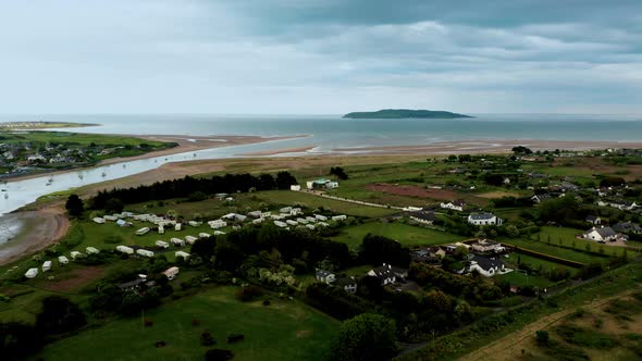 Aerial drone view over Irish coastal village alt