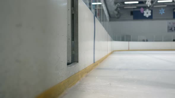 Young Woman Finishes Training and Leaves the Ice