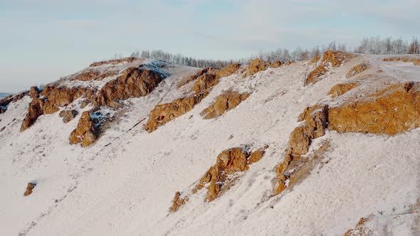 The Red Ridge rock Eastern slope of the Torgash ridge Winter Forest Cliffs Krasnoyarsk alt