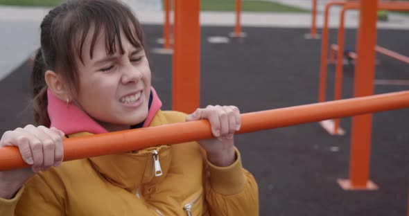 Child Exercises on Bars alt