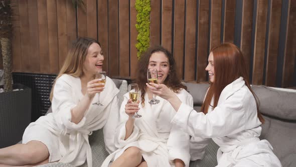 Relaxed Ladies Enjoy Drinking Champagne at Spa