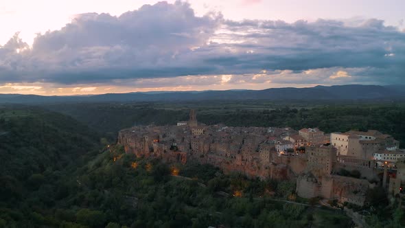 Amazing Sunset in Pitigliano, Italy. Aerial view of the town in Tuscany 4K