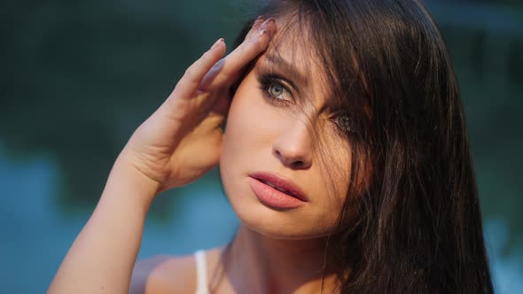 Portrait of a Pretty Girl Looking To the Side Outdoors alt