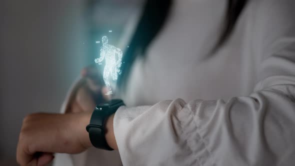 Woman pressing buttons on smart watch and checking workout equipment app alt