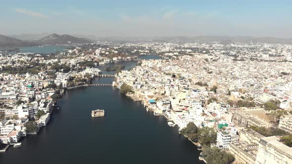 Mohan Mandir Temple in the middle of Lake Pichola Canal amidst the old city in Udaipur, India alt