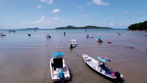 Amazing aerial view of Longtail fishing boats in the tropical sea at Rawai beach Phuket Thailand alt