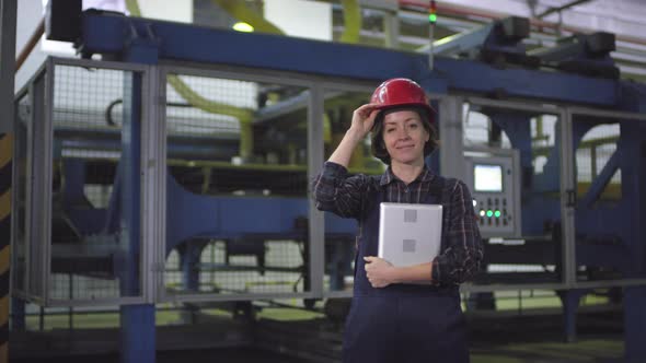 Smiling Female Cutting Machine Operator Posing at Industrial Plant alt