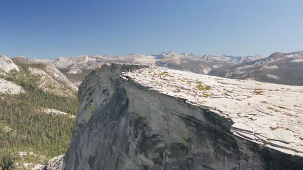 Yosemite. Steep Slope of Famous Half Dome Cliff with People on the Top. Aerial Observation alt
