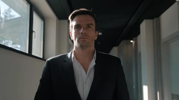 Handsome Businessman Walking Corridor at Hotel. Business Man Walking at Hotel alt