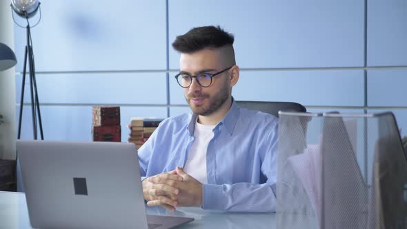 Close Up Man Person Using Video Conferencing technology in Home Office for video call alt