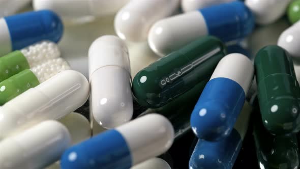 Many Pills and Vitamins of Different Colors alt