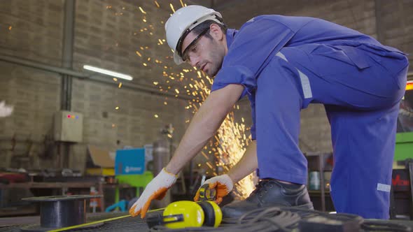 worker in a safty uniform wear welders leathers alt