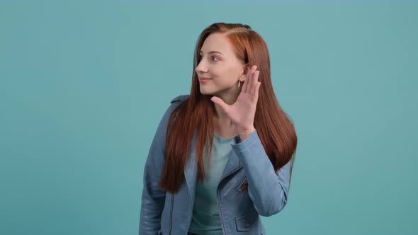 Curious Young Woman Try To Hear You with Hand Near Ear alt