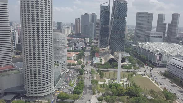 Aerial view of Singapore Marina Bay Sands mall with canal, road, cars. Modern skyscrapers in city