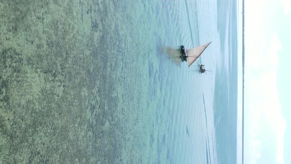 Tanzania Vertical Video  Boat Boats in the Ocean Near the Coast of Zanzibar Aerial View alt