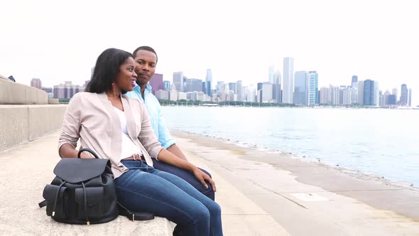Happy black couple relaxing in Chicago alt