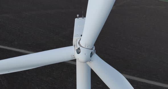 Wind Turbine Blades and Rotor Turn in Close Up Drone View alt