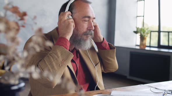 Stylish Senior Writer Relaxing after Work alt