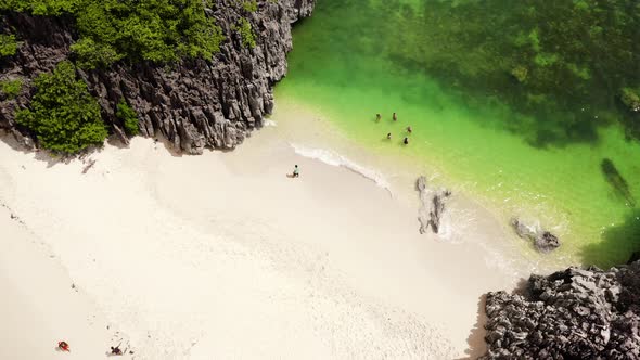 Tourists Relax on the Beach. Caramoan Islands, Camarines Sur, Matukad, Philippines. Tropical Island alt