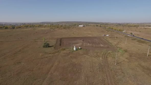 Aerial Shot of Small Oil Well in Field