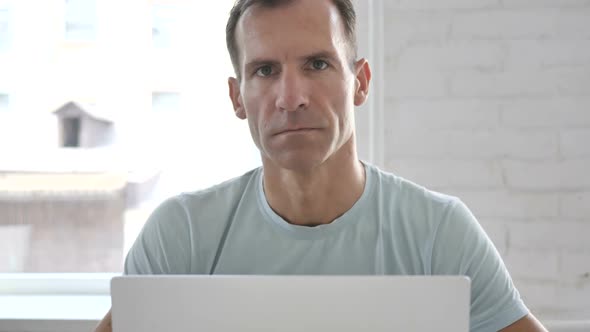 No Man Rejecting Offer By Shaking Head alt