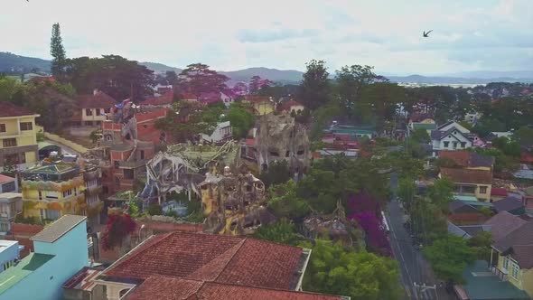 Drone Flies Around Crazy House and Birds Fly Past alt