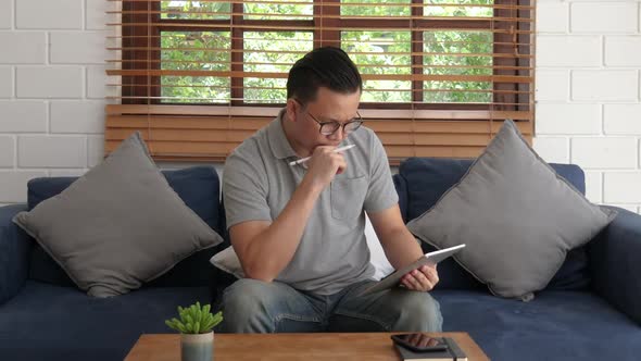 Man Using Tablet alt