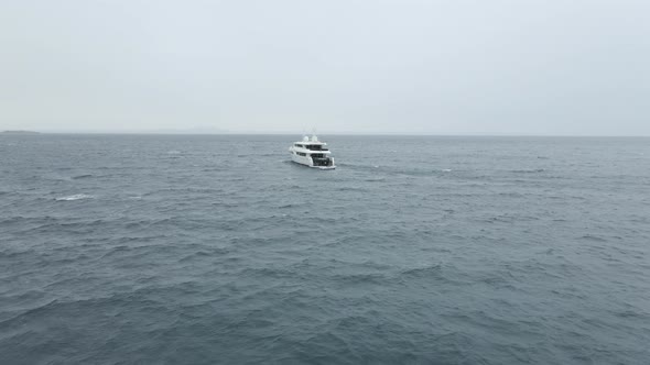 Motor Yacht Floating On Wavy Water Of Palma Bay In Majorca Spain alt