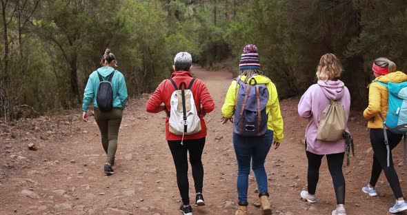 Multi generational women walking outdoor during trekking day